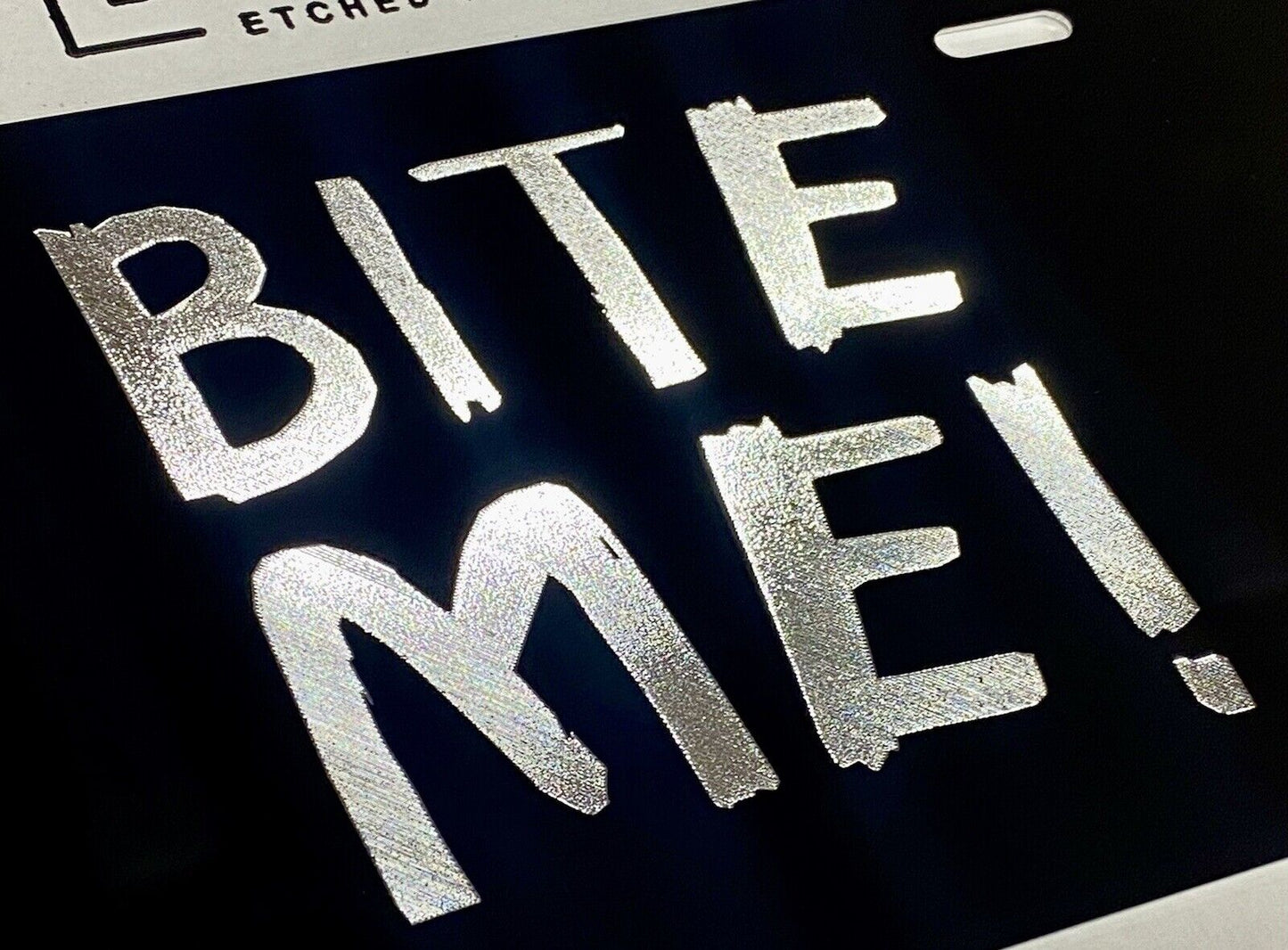 Silver Engraved BITE ME! Car Tag